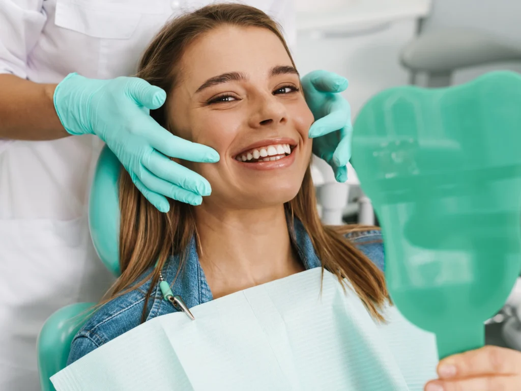 young woman smiling after professional teeth cleaning Deep River, CT